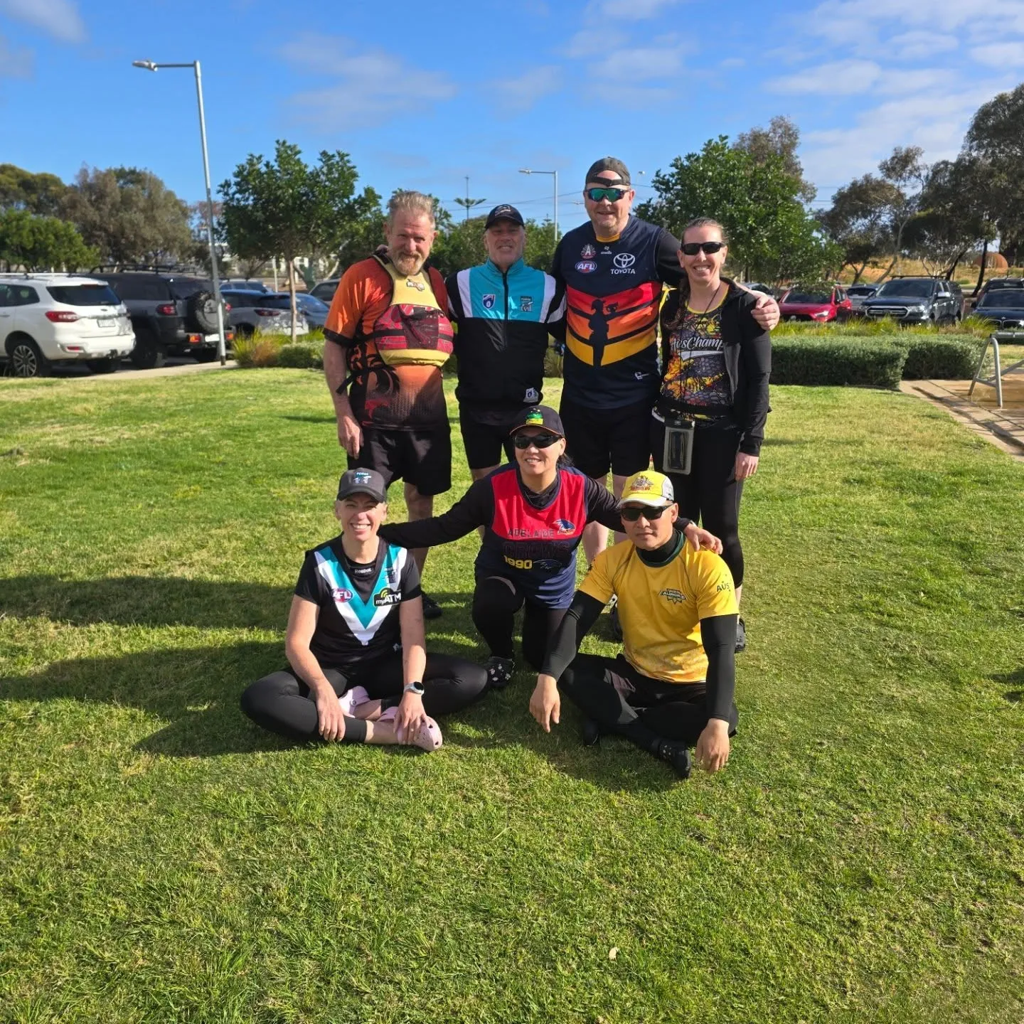 A group of ACDC members on the grass after a session
